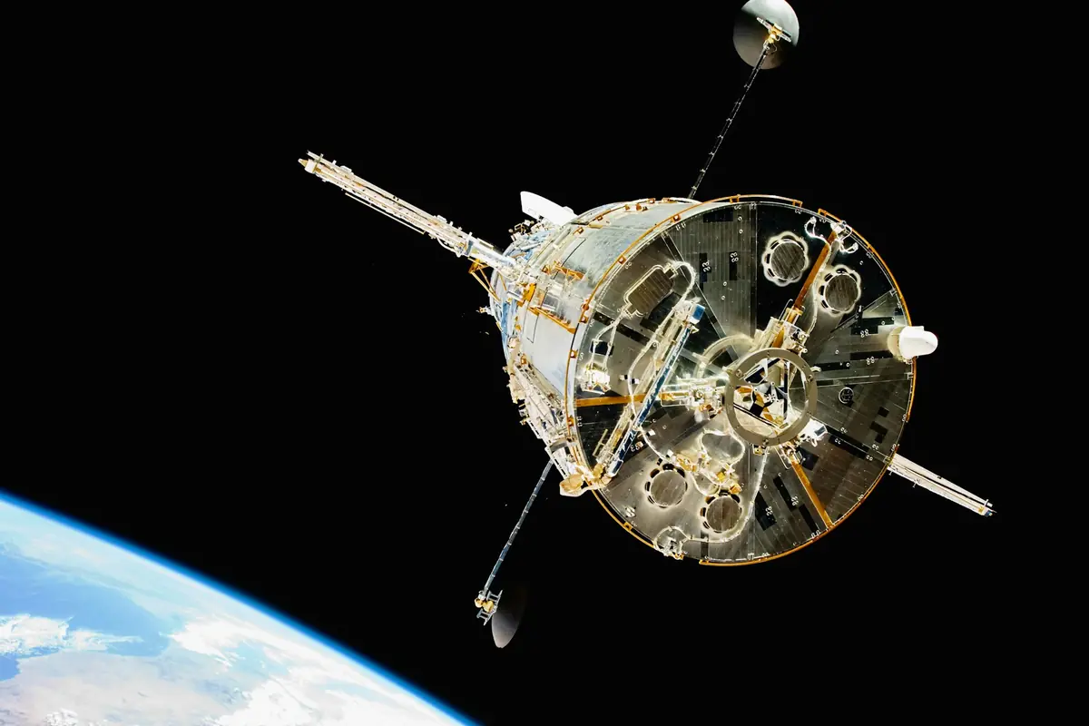 A spacecraft orbiting above Earth