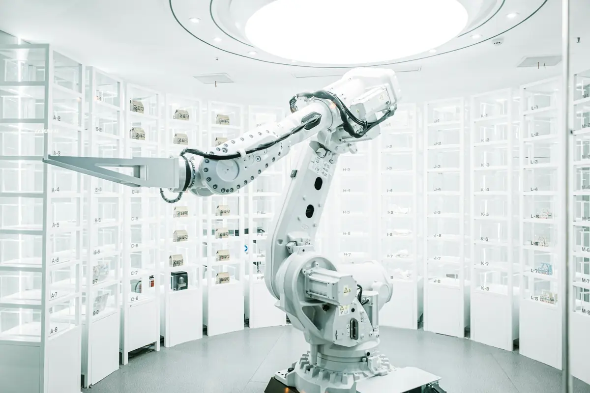 An industrial robot operating inside a bright automated facility
